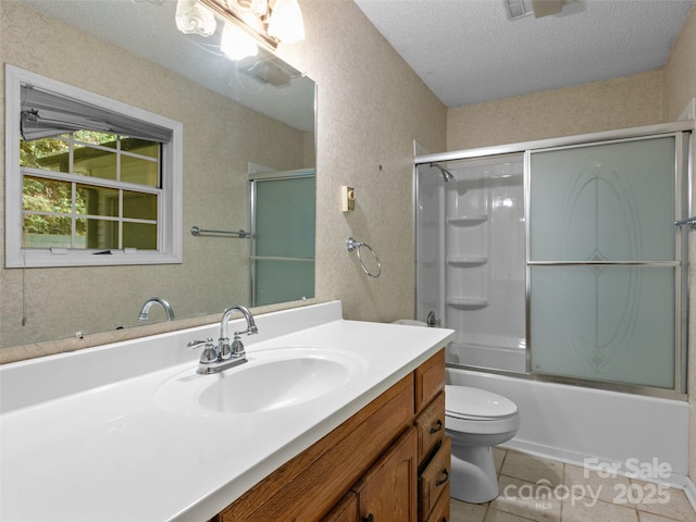 416 Hunters Glen Ln, Hendersonville, NC 28739 - full bath featuring a textured ceiling, tile patterned flooring, vanity, bath / shower combo with glass door, and toilet