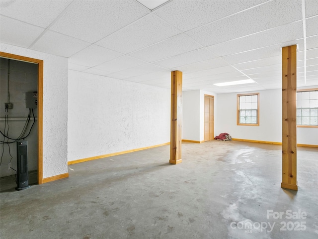 416 Hunters Glen Ln, Hendersonville, NC 28739 - below grade area with baseboards, a textured wall, and a paneled ceiling