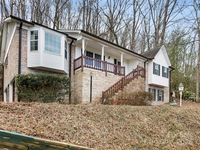 416 Hunters Glen Ln, Hendersonville, NC 28739 - single story home featuring covered porch, brick siding, and stairway