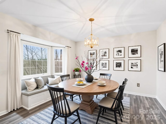 416 Hunters Glen Ln, Hendersonville, NC 28739 - dining area with baseboards, dark wood-style flooring, and a notable chandelier