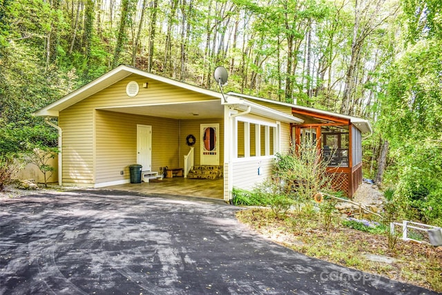 exterior space featuring a carport