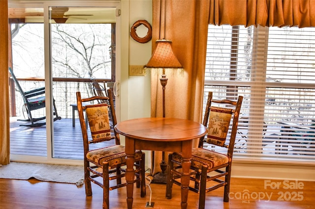 dining area featuring hardwood / wood-style flooring and ceiling fan