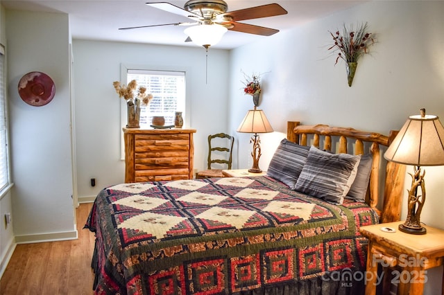 bedroom featuring ceiling fan and hardwood / wood-style floors