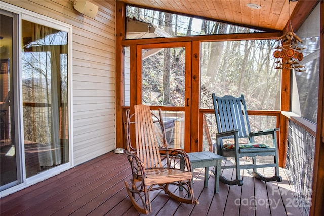 sunroom with wood ceiling and vaulted ceiling