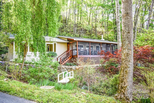 single story home with a sunroom