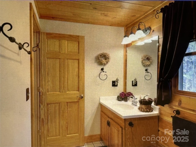 bathroom with wooden ceiling, vanity, and tile patterned floors