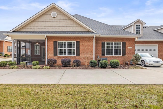 view of front of home featuring a garage and a front lawn