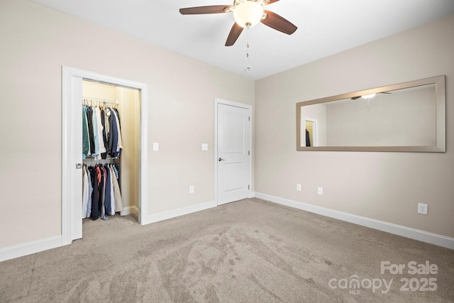 unfurnished bedroom featuring ceiling fan, a closet, and light carpet