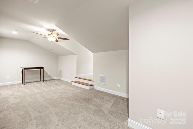 bonus room featuring lofted ceiling, light colored carpet, and ceiling fan