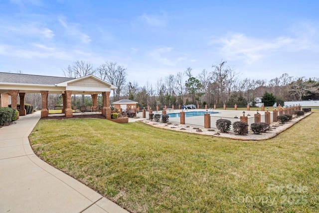 exterior space featuring a gazebo and a community pool