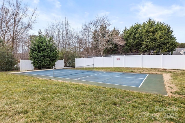 view of sport court featuring a yard