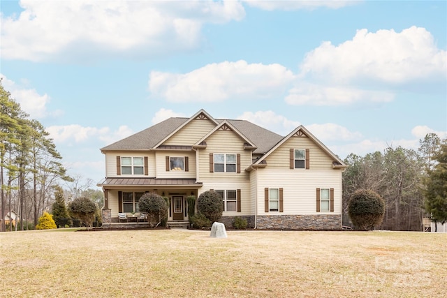 view of front of home with a porch and a front lawn