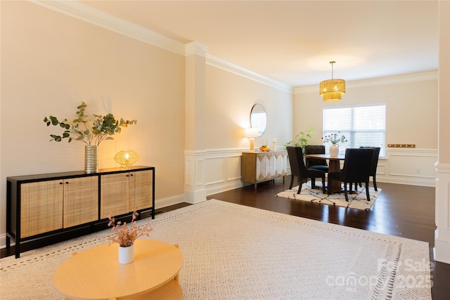 dining room with crown molding and wood-type flooring