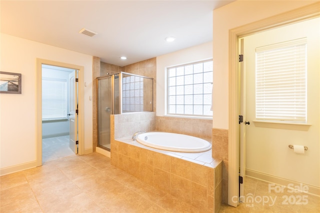 bathroom featuring independent shower and bath and tile patterned floors