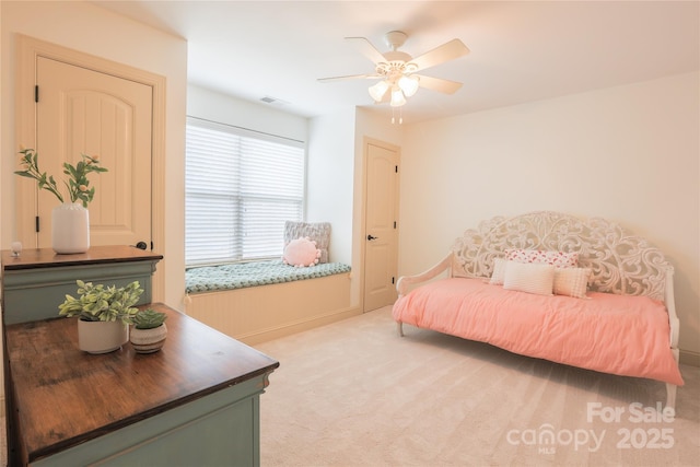 carpeted bedroom with ceiling fan