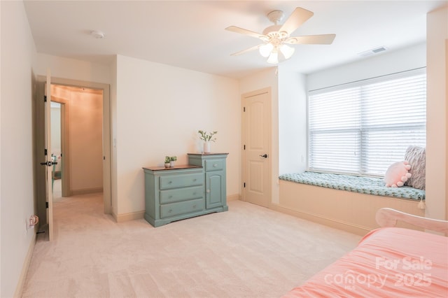 bedroom featuring light carpet and ceiling fan