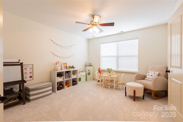 game room with light colored carpet and ceiling fan