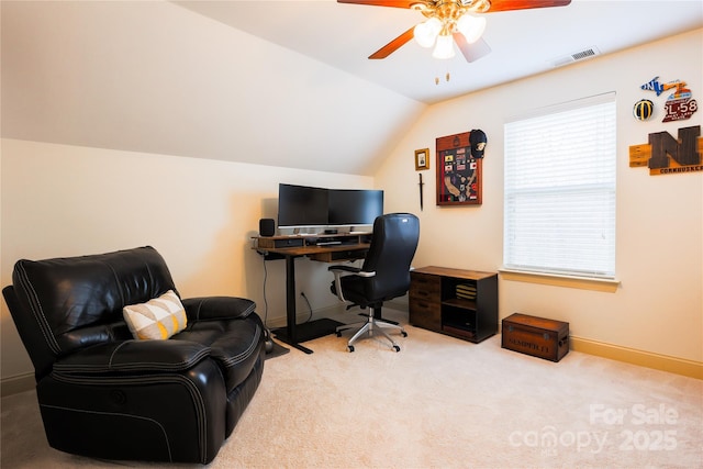 carpeted office space featuring lofted ceiling and ceiling fan