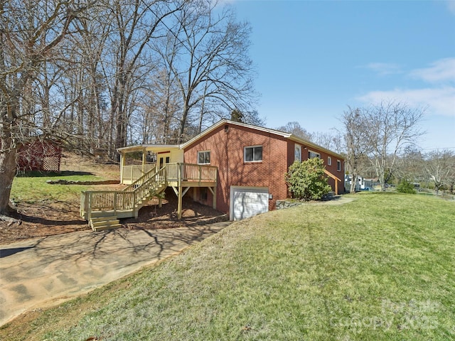 view of home's exterior with a deck, an attached garage, brick siding, stairs, and a lawn