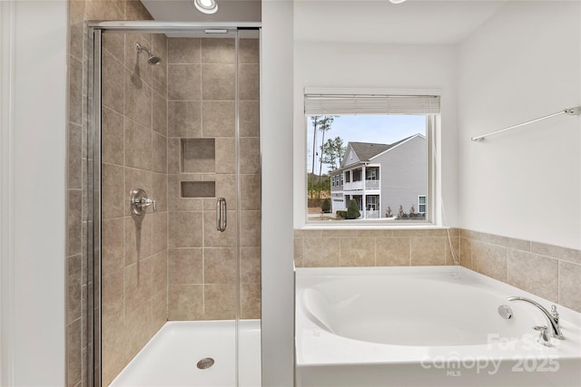 bathroom featuring plus walk in shower