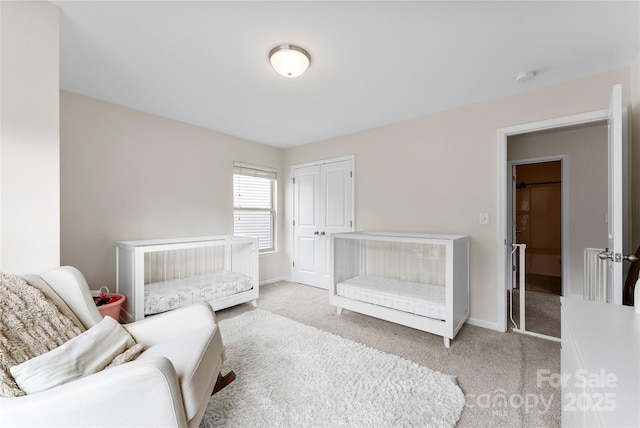 carpeted bedroom featuring a closet