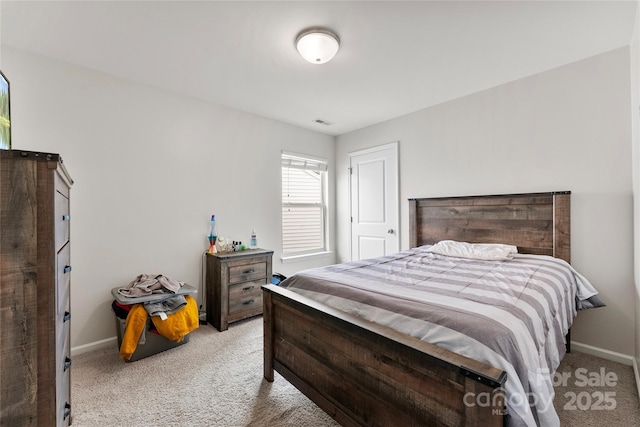 bedroom with light carpet