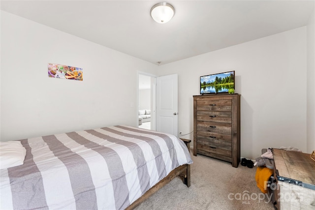 bedroom featuring light colored carpet