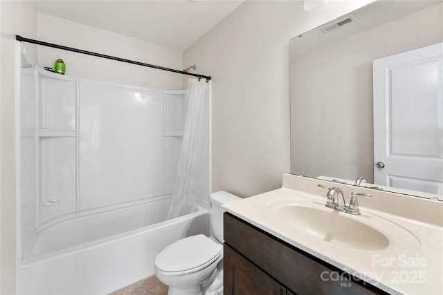 full bathroom featuring vanity, shower / bath combo, and toilet