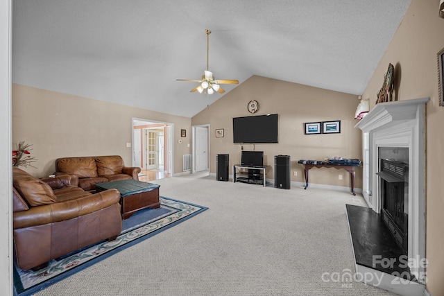 carpeted living room with high vaulted ceiling, a textured ceiling, and ceiling fan