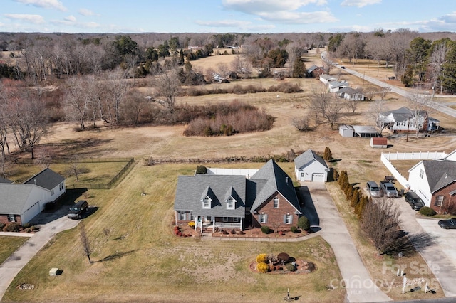 birds eye view of property with a rural view