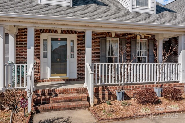 property entrance featuring a porch