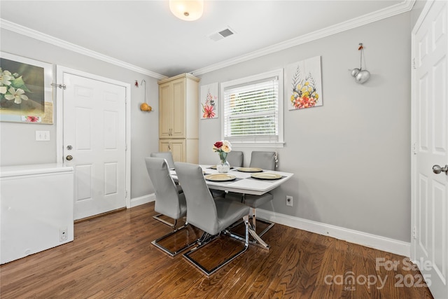 dining area featuring ornamental molding and hardwood / wood-style floors