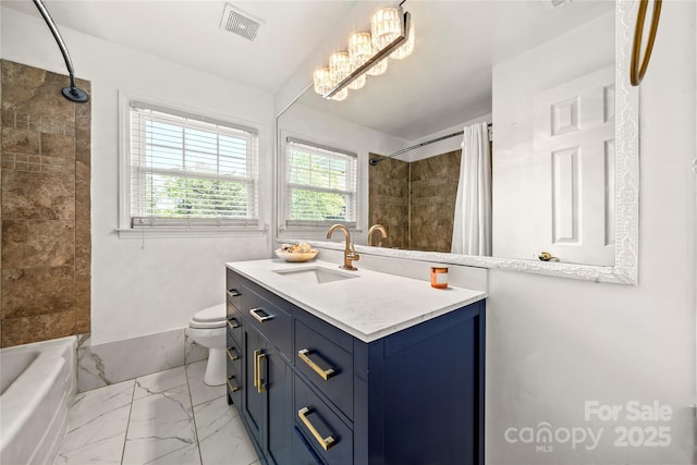 full bathroom featuring vanity, shower / bathtub combination with curtain, and toilet