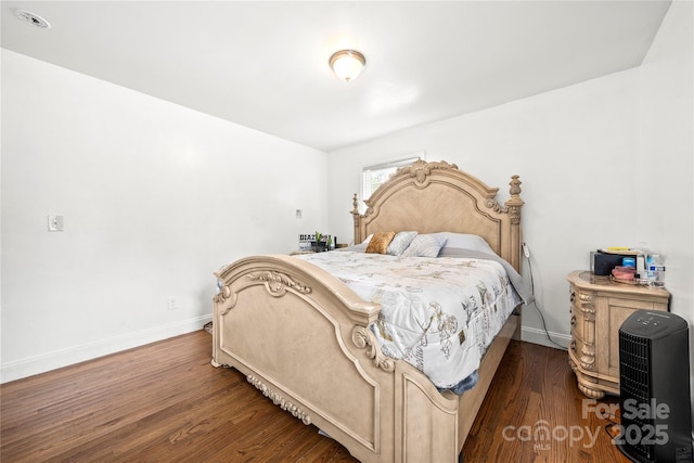 bedroom featuring dark hardwood / wood-style flooring