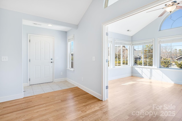 foyer featuring plenty of natural light, visible vents, and light wood-style floors