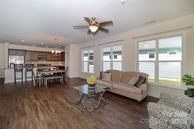 living room with crown molding, dark hardwood / wood-style floors, and ceiling fan with notable chandelier