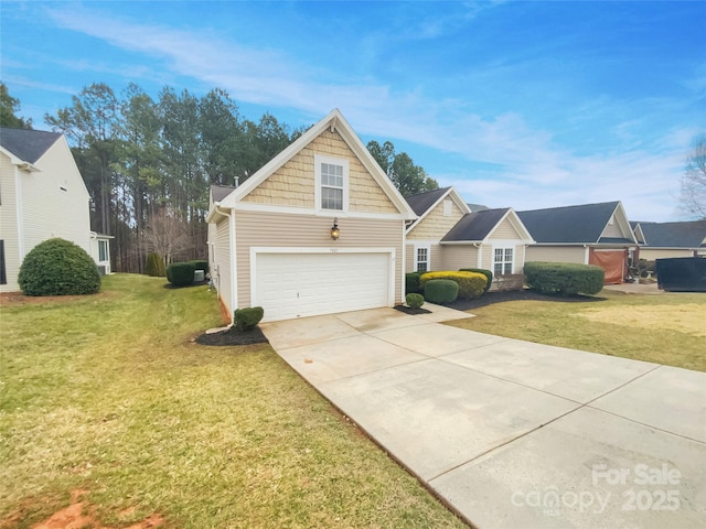 view of front of home featuring a garage and a front yard