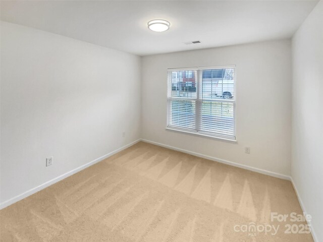 spare room featuring carpet flooring