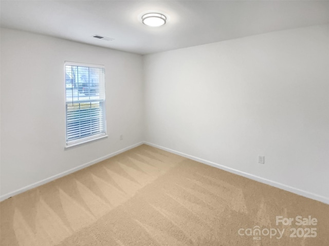 spare room featuring carpet flooring