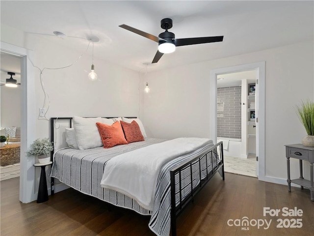 bedroom featuring ensuite bathroom, dark hardwood / wood-style floors, and ceiling fan