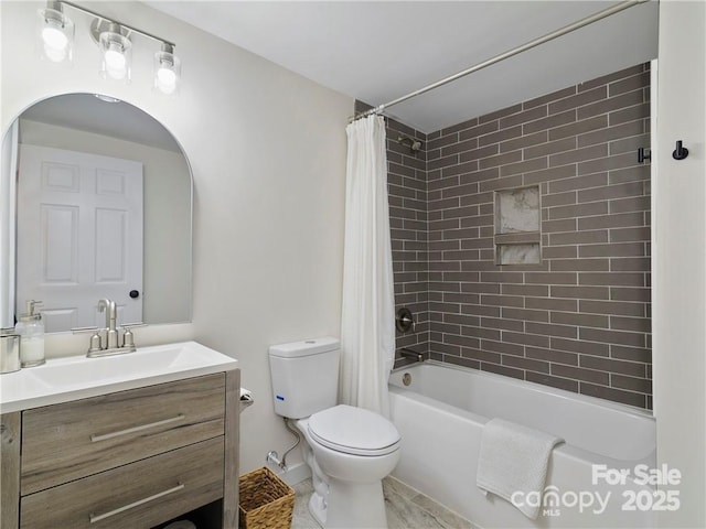 full bathroom featuring shower / tub combo with curtain, vanity, and toilet