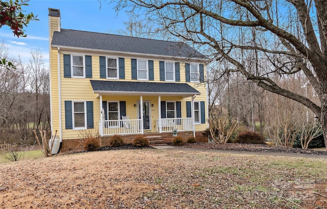 colonial house featuring a porch