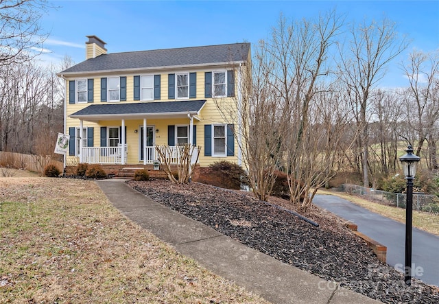 colonial house featuring covered porch