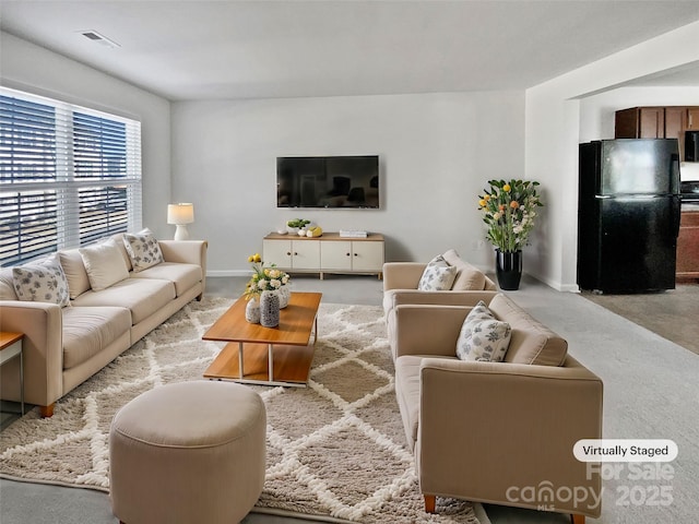 living room featuring light colored carpet