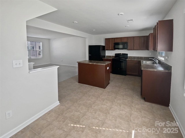 kitchen featuring sink, plenty of natural light, a center island, dark brown cabinetry, and black appliances