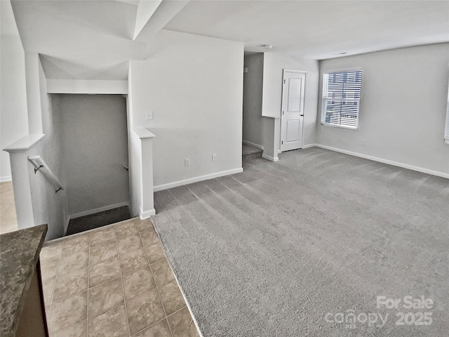 unfurnished living room with tile patterned floors