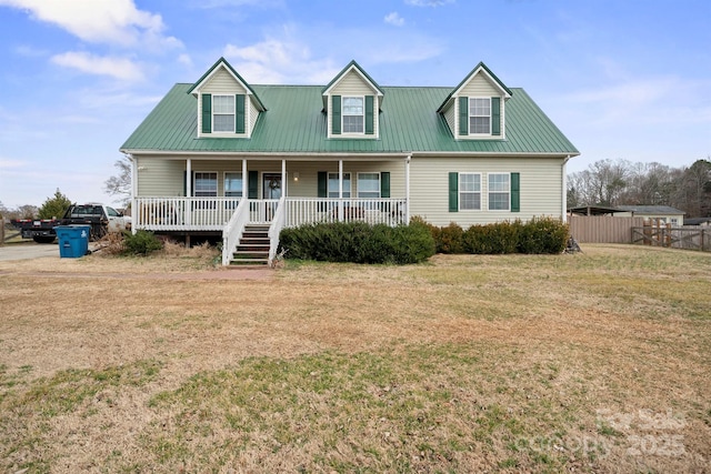 cape cod home featuring a front lawn and a porch