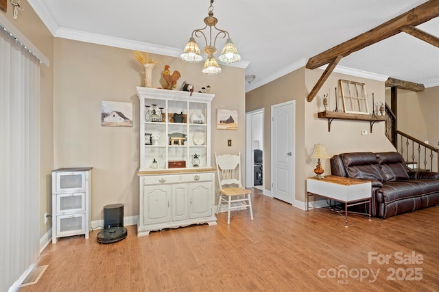 interior space featuring an inviting chandelier, hardwood / wood-style flooring, and ornamental molding