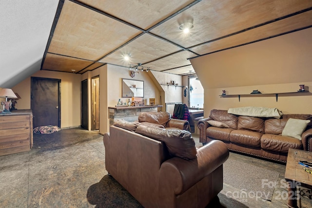 living room featuring vaulted ceiling