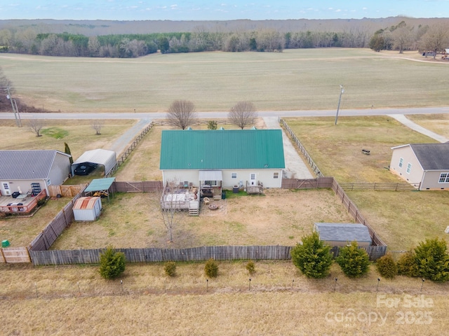 birds eye view of property featuring a rural view